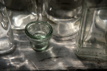 Different glass bottles on the windowsill.
