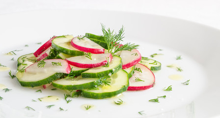cucumber and radish salad dressed with vinegar and oil 