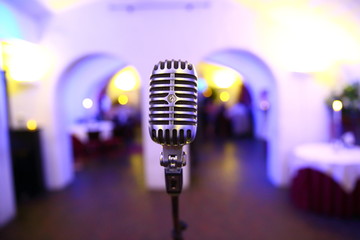 close up of microphone ready to be used at wedding party
