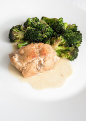 rabbit saddle braised with sour cream and white wine garnished with parfried broccoli