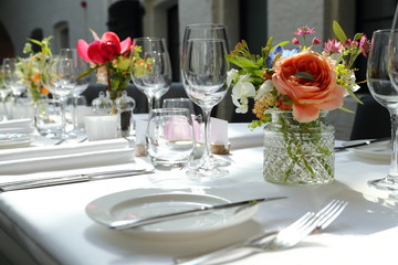 empty wine glasses on a beautifully set dinner table