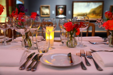 empty wine glasses on a beautifully set dinner table