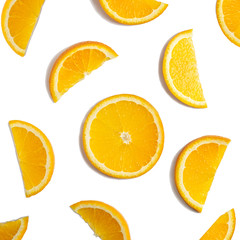 Fruit pattern of orange slices isolated on white background. Top view. Flat lay.