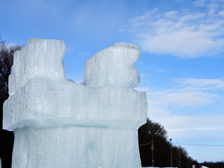  Ice tower on a background of forest and sky