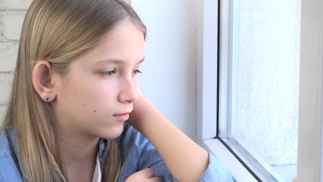 Sad Kid Looking on Window, Unhappy Child,  Bored Thoughtful Girl, Sadness on Teenager Face, Isolated People Quarantined at Home