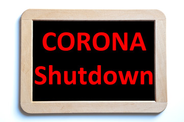 Corona schutdown in red letters written on information board