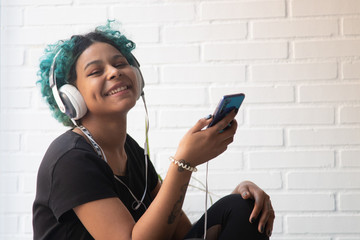 girl with mobile phone and headphones