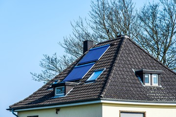 Vacuum solar water heating system on the roof of the house