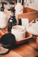 Natural Spa, Scrub, peeling with sea salt and sugar Still life. Organic spa cosmetic products and natural skincare concept on dark wooden background