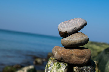 Fototapeta na wymiar zen stones by the sea or ocean on a sunny day