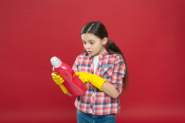 Disinfecting gel. Alcohol antibacterial disinfection. Girl in rubber gloves for cleaning hold plastic bottle chemical liquid. Help clean up. Use product for cleaning. Housekeeping. Cleaning supplies