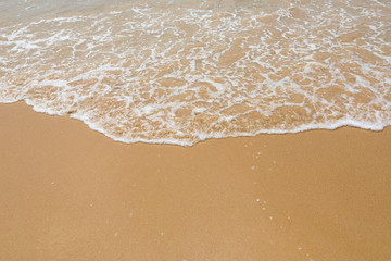 Fototapeta na wymiar Sand beach and wave, top view