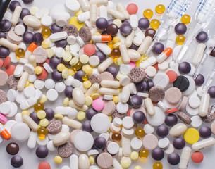 White pills, white background