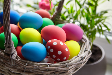 Fototapeta na wymiar Easter Day, basket with colorful Easter Eggs