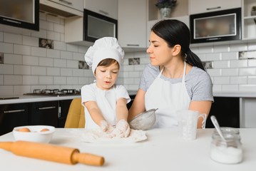 Happy family. Mother teaching her son how to cooking cake menu in morning. healthy lifestyle concept.. Baking Christmas cake and cook concept