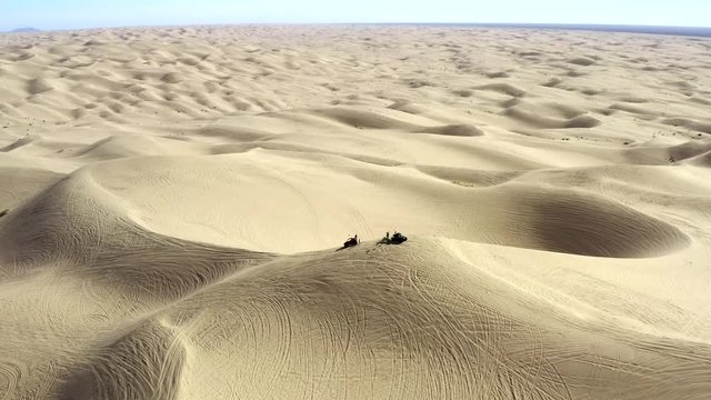 Aerial tracking over ATV's in the Imperial Sand Dunes, Glamis, California