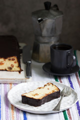 Lviv cheesecake, a traditional Ukrainian dessert with raisins, coated with chocolate icing.