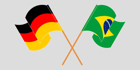 Crossed and waving flags of Brazil and Germany