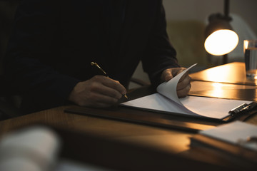 Male lawyer working at table in office, closeup