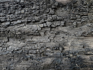 Fototapeta premium Charcoal crayon Carbon black background . A large plank of wood burned texture .