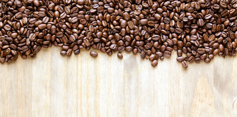 Coffee beans - for inspirational concepts & ideas - panorama header / banner on a natural, rustic, background texture, with design space.