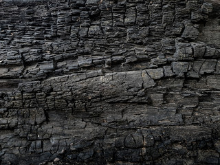 Obraz premium Charcoal crayon Carbon black background . A large plank of wood burned texture .