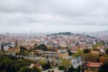 Panoramic view from the roof of a house on the city of Barcelona, Spain. Traveling Europe. Cloudy day. Spanish architectural background