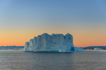 Obraz na płótnie Canvas Beautiful landscape with iceberg in Greenland at summer time. Sunny weather.