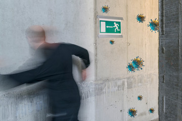 Corona Virus concept: Unidentifiable person running and fleeing towards emergency exit with corona...