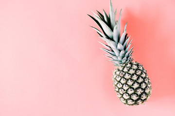 Summer minimal composition. Creative layout made of pineapple on pastel pink background. Flat lay, top view, copy space