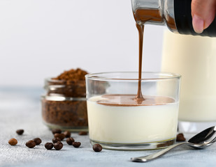 Dalgona frothy coffee trend korean drink latte espresso with coffee foam in glass cups