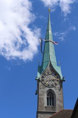 Old tower of Fraumuenster (Women's Minster) church with a clock at the city center of Zurich in Switzerland. 