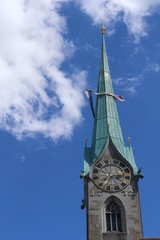 Old tower of Fraumuenster (Women's Minster) church with a clock at the city center of Zurich in Switzerland. 
