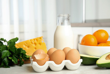 Fresh products rich in vitamin A on marble table