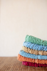 Colorful towels on background