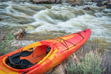 whitewater kayak and river rapid