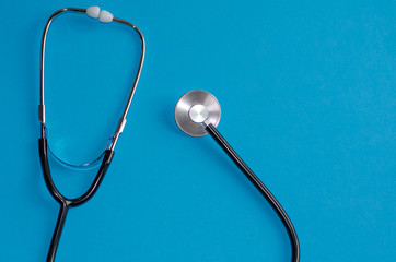 stethoscope on a blue background. medical concept, health care and the diagnosis of pneumonia in...