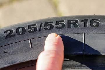 Side view of tire with tire width, height and wheel diameter designation