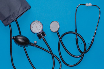 Aneroid blood pressure kit for pressure measurement on a blue background. medical concept, health...