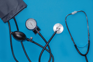 Aneroid blood pressure kit for pressure measurement on a blue background. medical concept, health...
