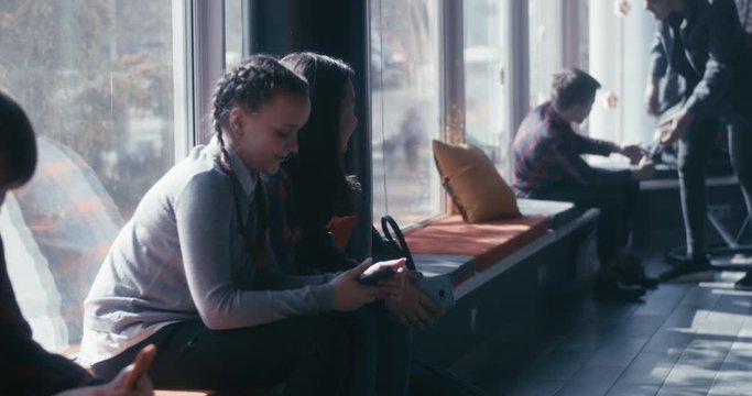 Girls watching a bully teasing boy