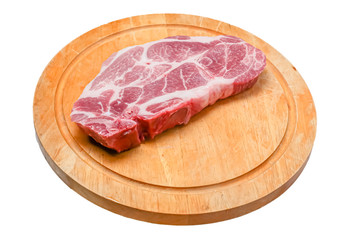 Raw steak from pork neck tender lies on a wooden Board on a white background. Isolated