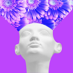 Modern art collage depicting a plaster sculpture of a woman and gerbera flowers. March 8 concept, art collage, holiday.