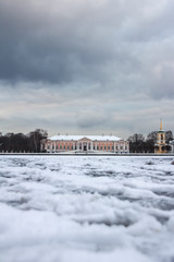 Fototapeta na wymiar Manor Palace in Kuskovo in winter, Moscow, Russia, view across the pond. Travel around Russia in winter season.