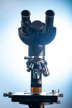 Mcroscope with metal lens at laboratory. Close-up shot
