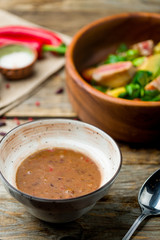 Mexican red bean soup on old wooden table