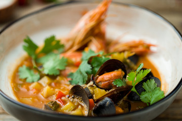 Seafood casserole bowl on wooden table