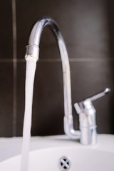 Metal tap and water closeup