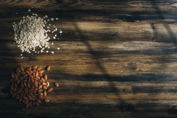 wooden table ready to cook with oats and almonds