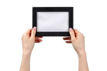 Female hands holding photo frame with copy space isolated on white